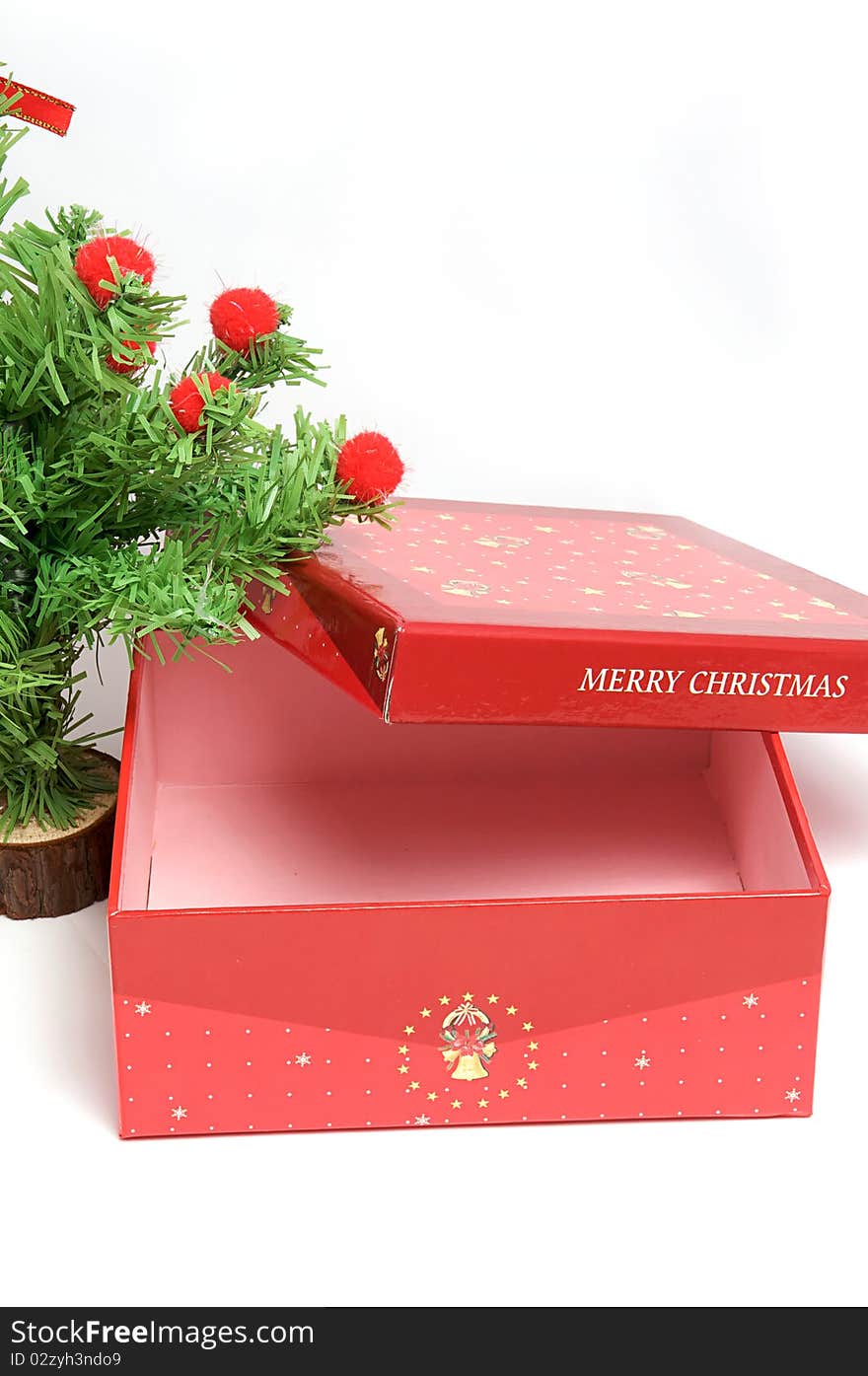 Red gift box and christmas tree on isolated background