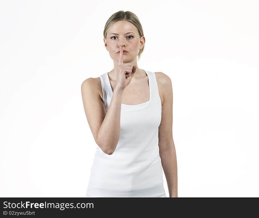 Young woman asking for silence with withe t shirt