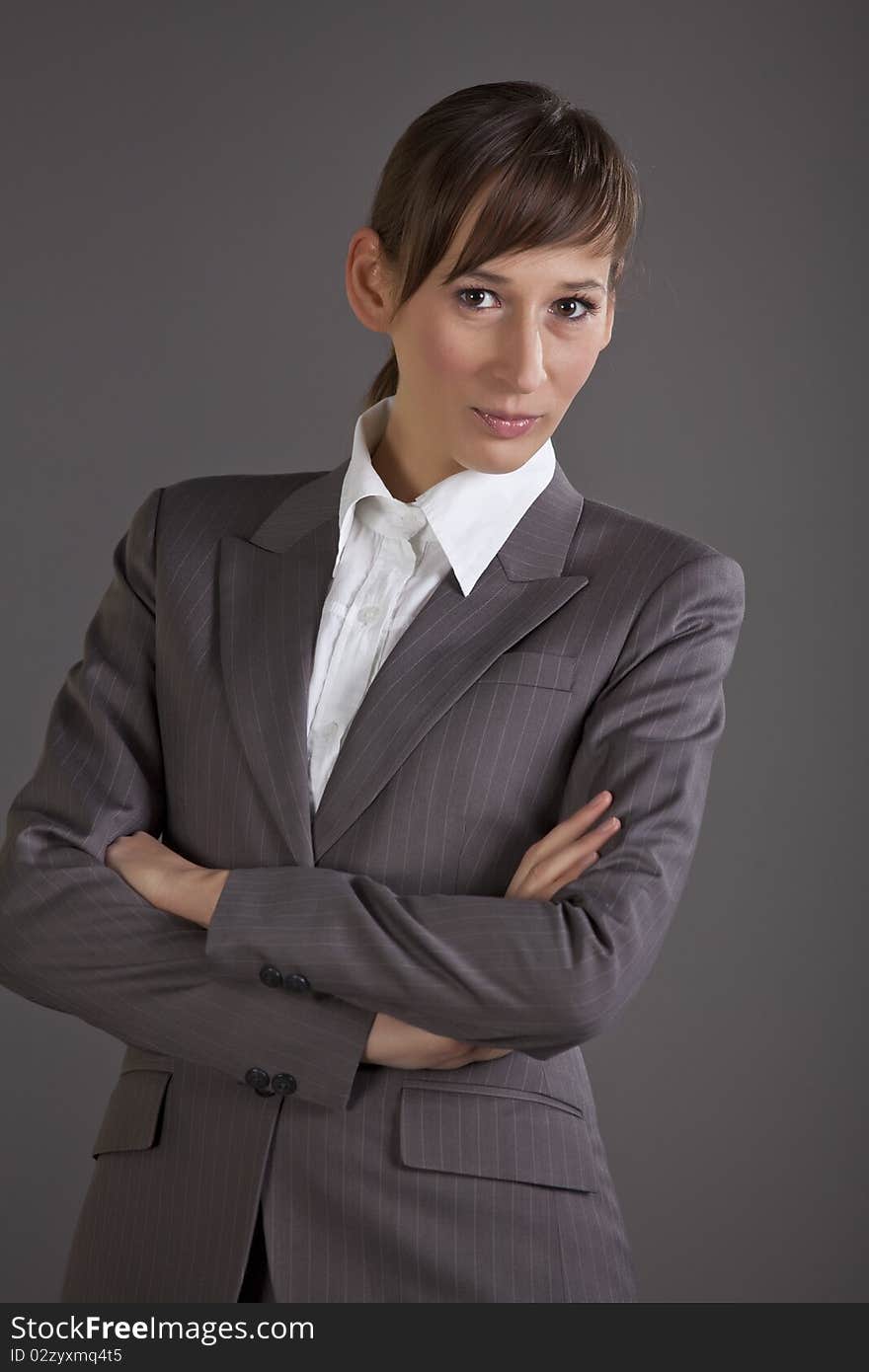 Portrait of business woman over grey background