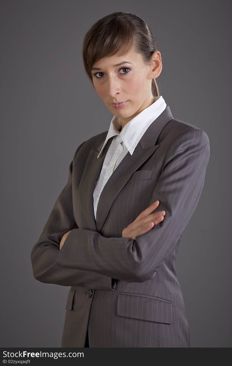 Portrait of business woman over grey background