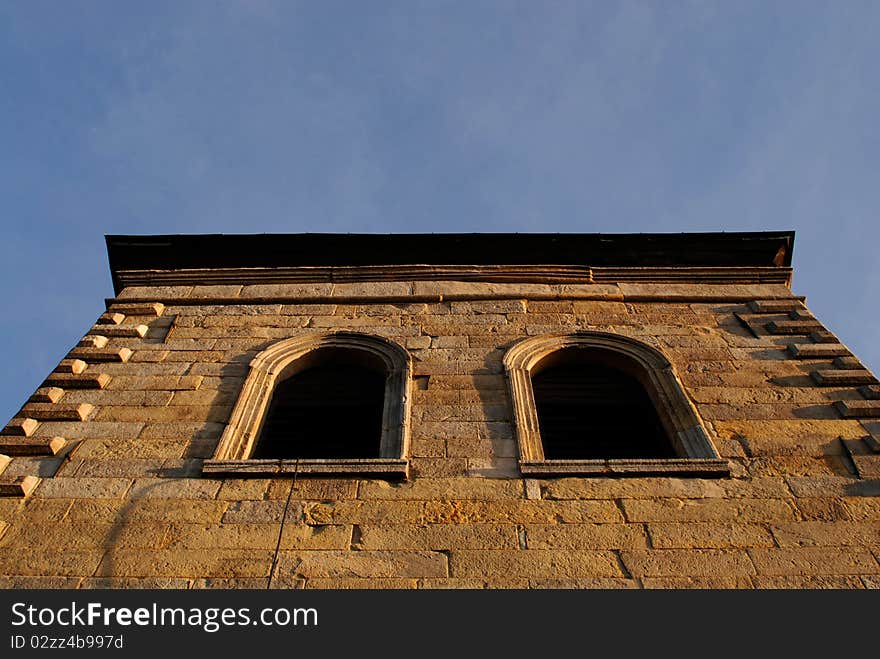 Window of the ancient tower stone wall. Window of the ancient tower stone wall