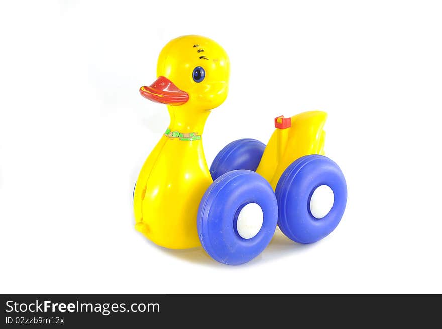 Old yellow duck toy on white background. Old yellow duck toy on white background