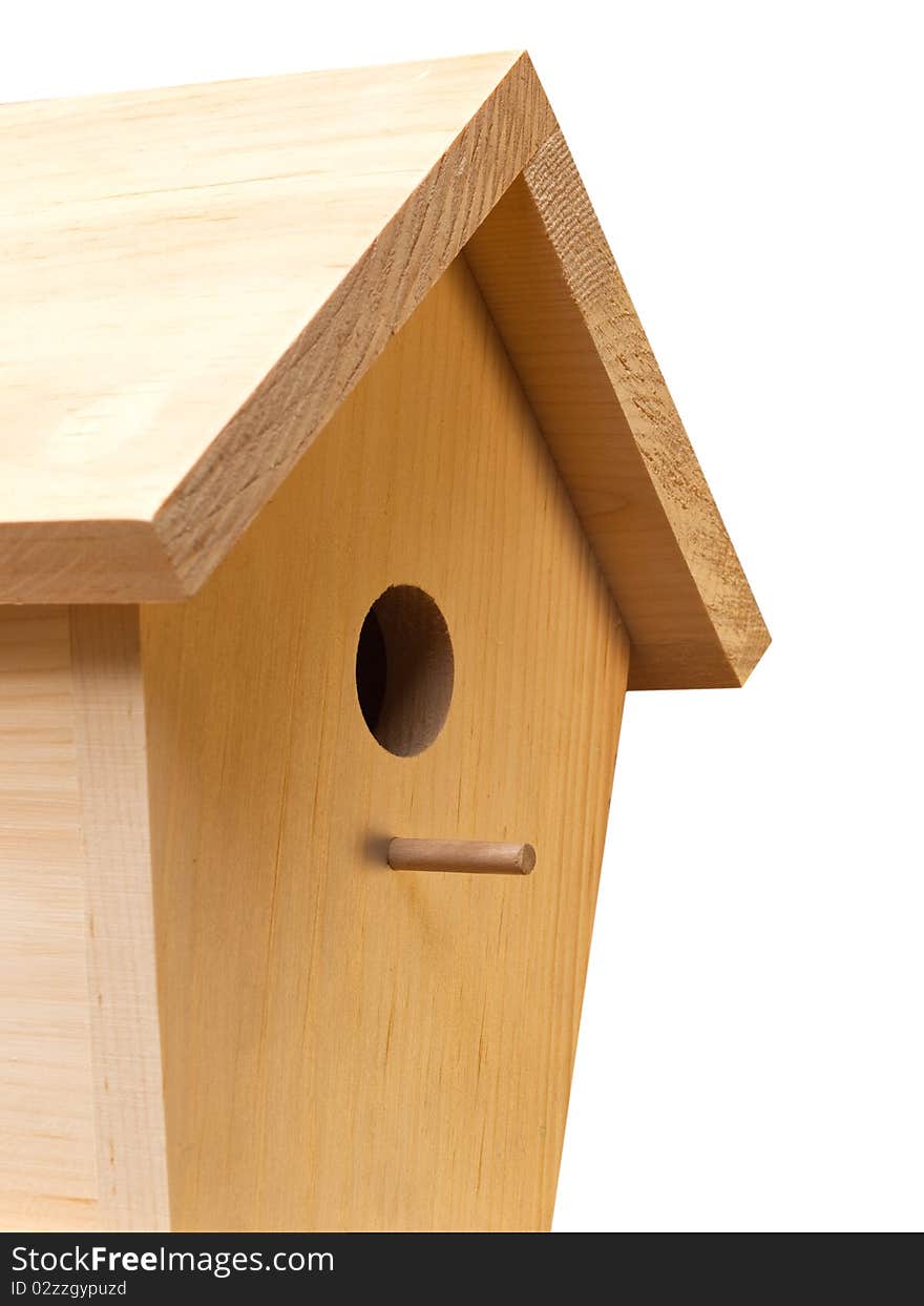 Unpainted birdhouse made of pine wood. Unpainted birdhouse made of pine wood