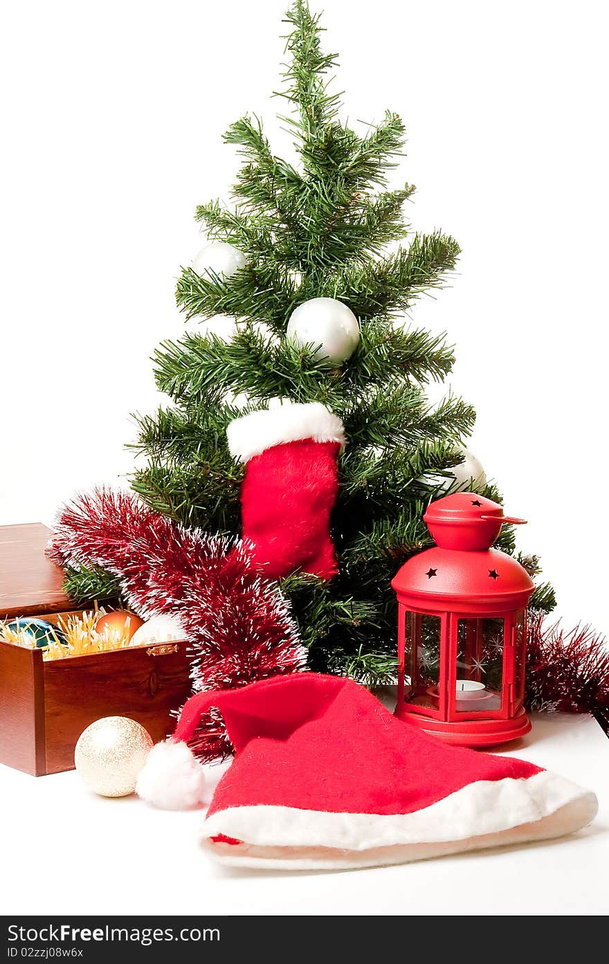 Christmas-tree decoration and gifts on a white background under a fur-tree for a card. Christmas-tree decoration and gifts on a white background under a fur-tree for a card