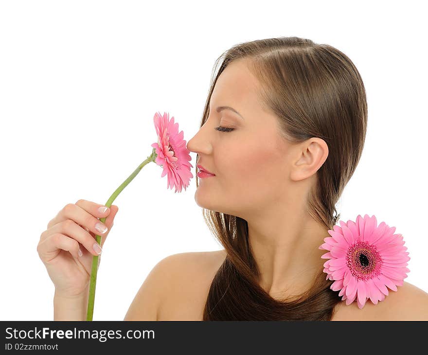 Beautiful woman with pure healthy skin and long hair smelling 2 pink flowers. isolated on white background. Beautiful woman with pure healthy skin and long hair smelling 2 pink flowers. isolated on white background