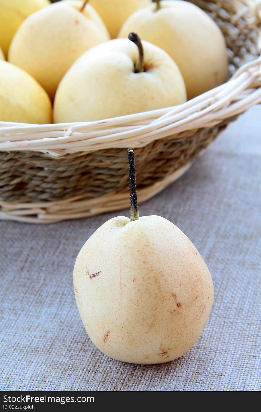 Beautiful ripe pears on a wooden table