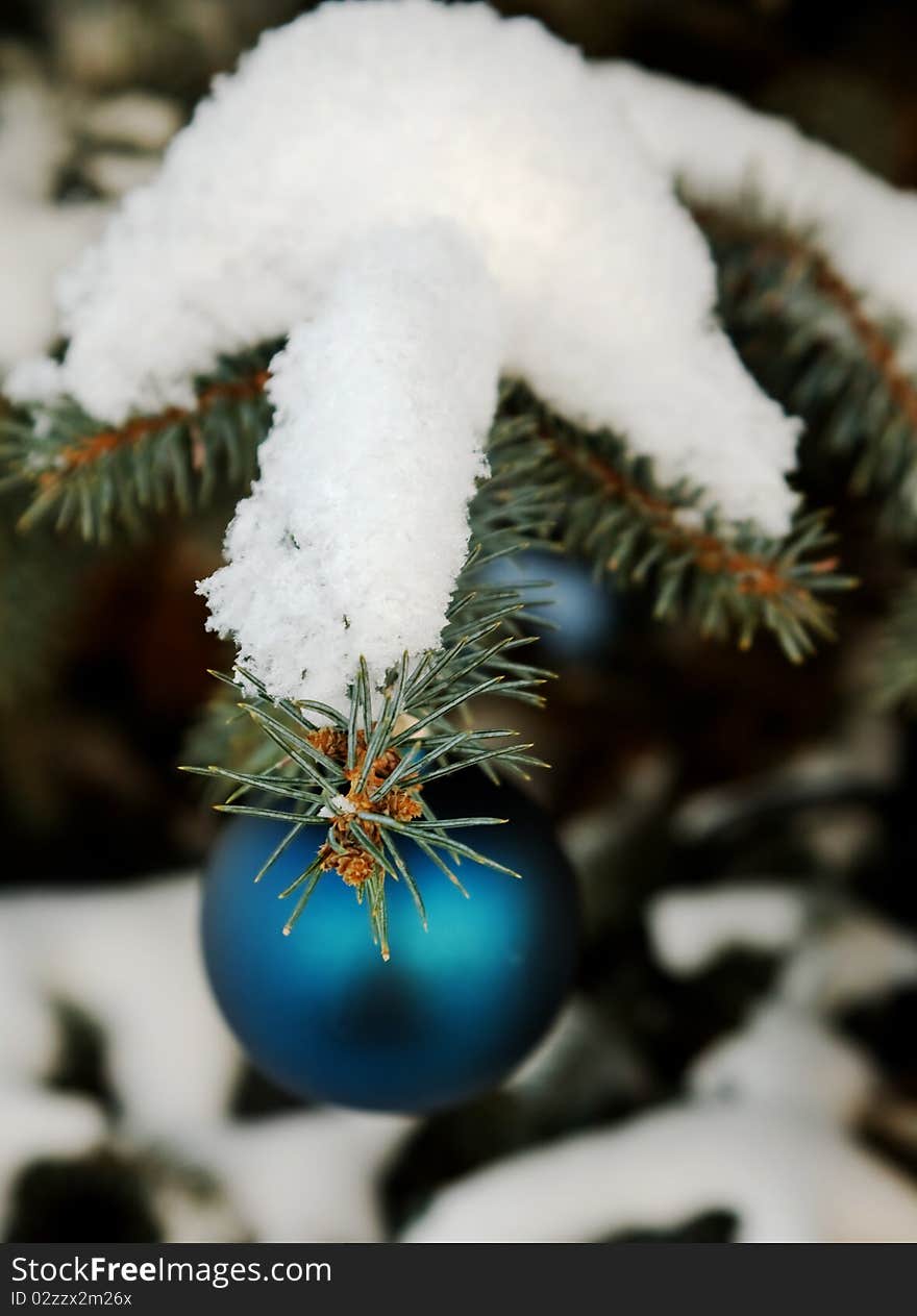 Christmas-tree decoration (green glass ball) on the tree outdoor. Christmas-tree decoration (green glass ball) on the tree outdoor