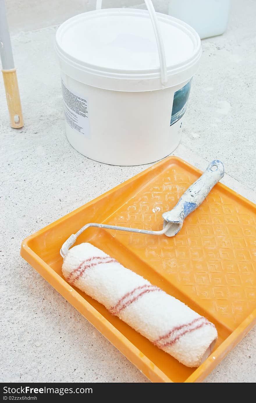 Painting tools with bucket on grid. Home renovation theme. Painting tools with bucket on grid. Home renovation theme