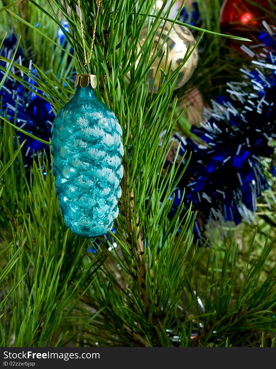 Blue glass cone and balls and tinsel on Christmas-tree. Blue glass cone and balls and tinsel on Christmas-tree