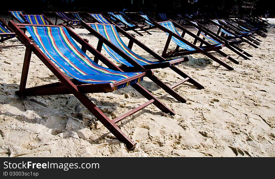 Wooden rest bench for rent on the beach. Wooden rest bench for rent on the beach