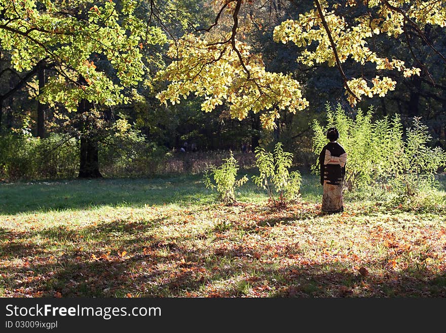 A Japanese Lady In An Autumn Forest