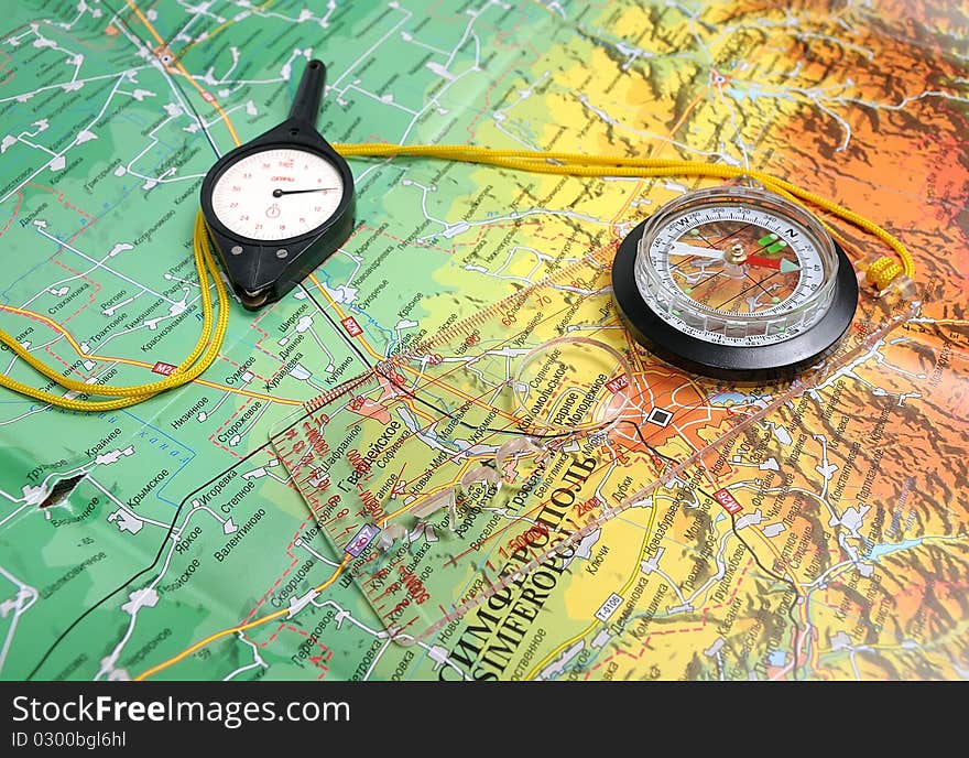 Travel compass with ruler and curvimeter on the map. Travel compass with ruler and curvimeter on the map