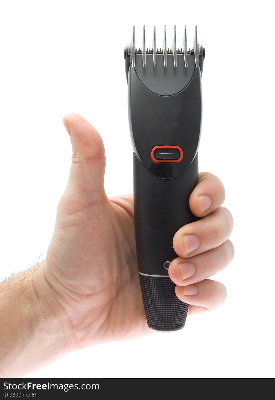 Trimmer in hand on white background