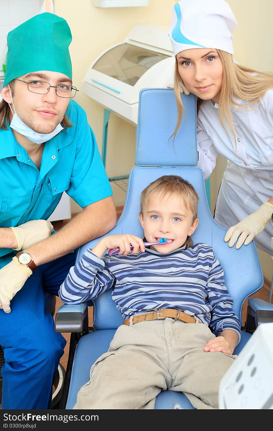 Shot of a little boy with dentists in a dental surgery. Healthcare, medicine. Shot of a little boy with dentists in a dental surgery. Healthcare, medicine.