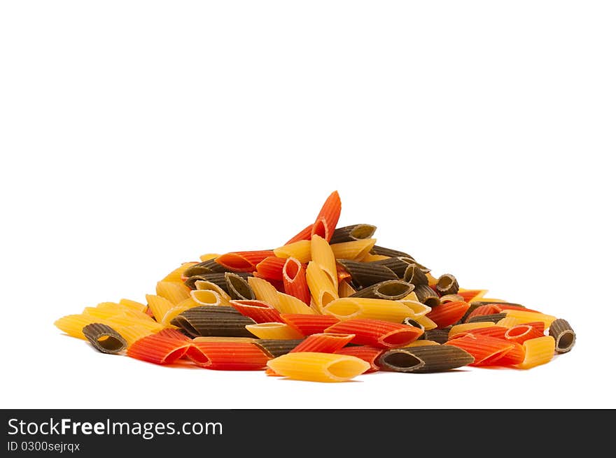 Heap of raw traditional tricolore italian pasta mezze penne isolated on white background. Heap of raw traditional tricolore italian pasta mezze penne isolated on white background