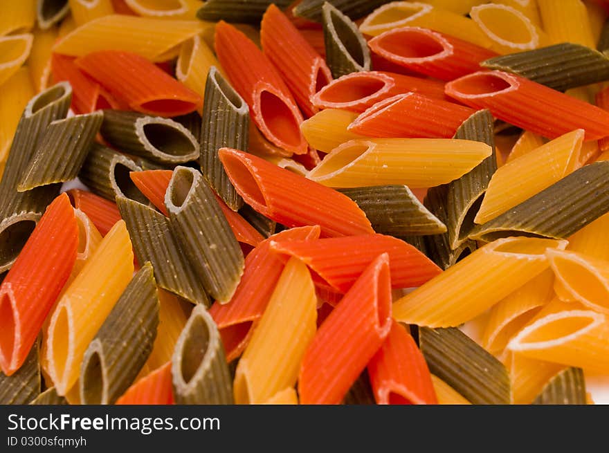 Closeup shot of raw traditional italian pasta isolated on white background. Closeup shot of raw traditional italian pasta isolated on white background