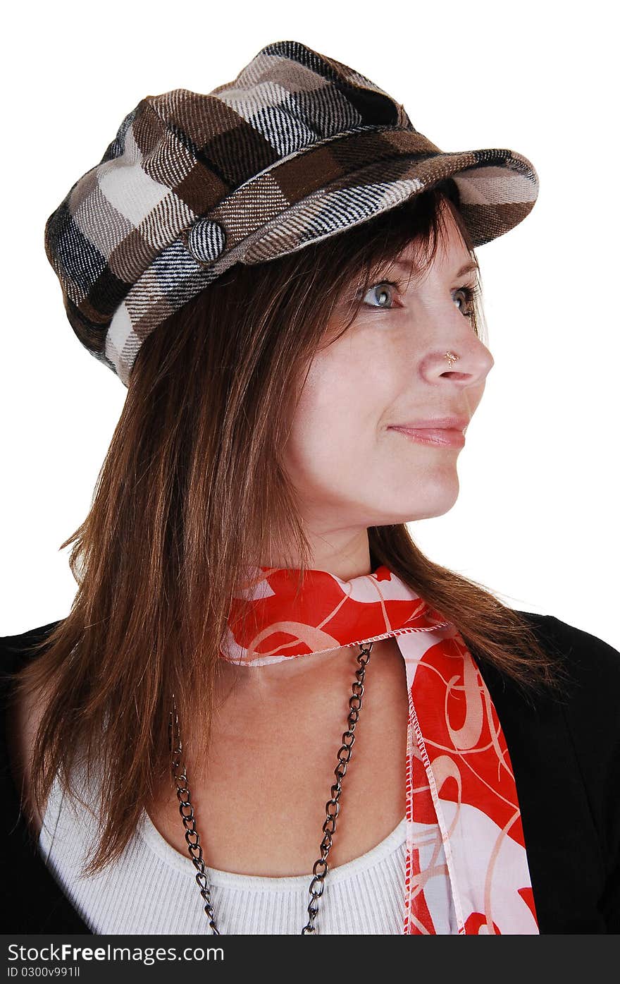 An middle aged woman in an black sweater and a gray brown hat standing in the studio with a red scarf, for white background. An middle aged woman in an black sweater and a gray brown hat standing in the studio with a red scarf, for white background.