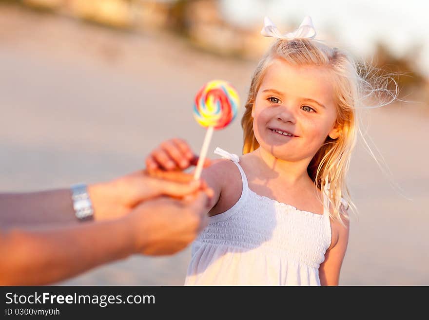 Adorable Little Girl Picking out Lollipop