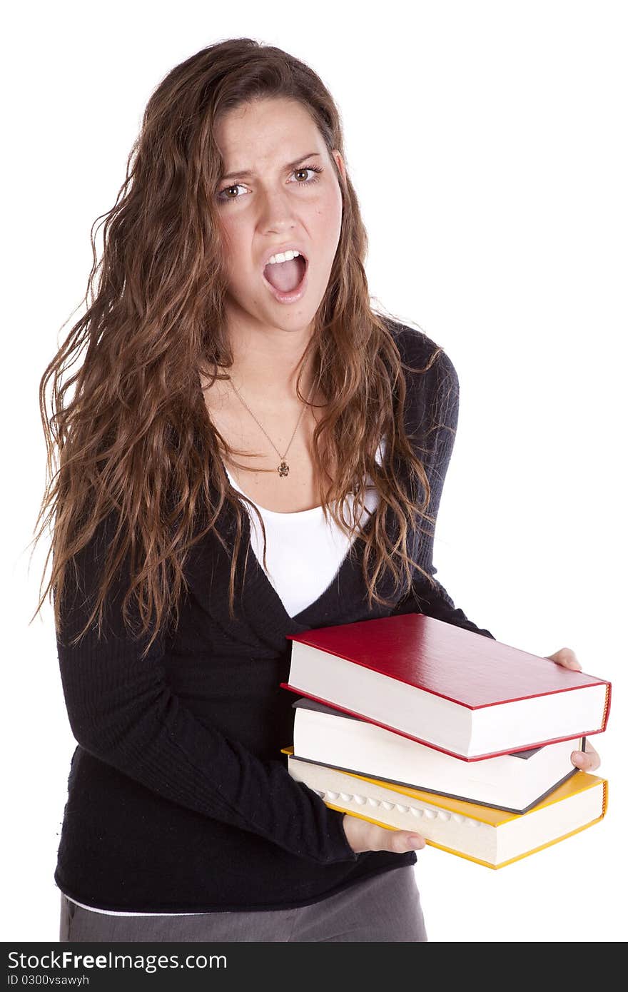 A woman is holding a stack of books and screaming. A woman is holding a stack of books and screaming.