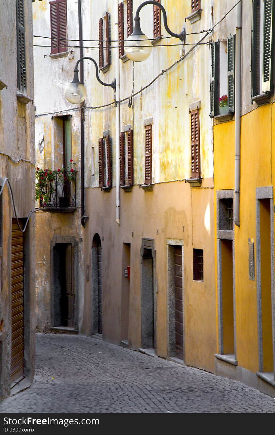 Narrow street of a village with old houses. Narrow street of a village with old houses