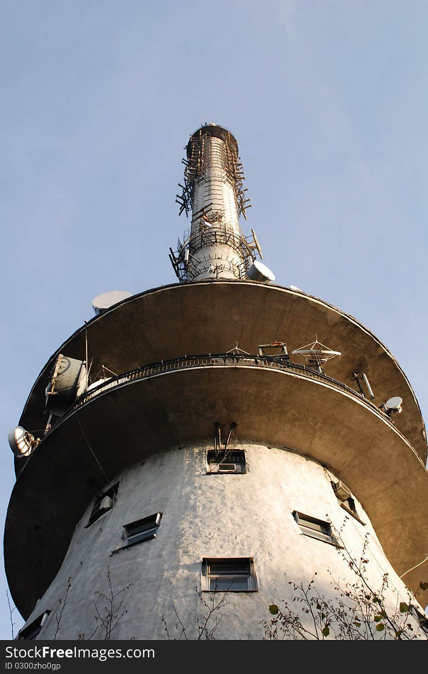 Communications tower with a beautiful blue sky.