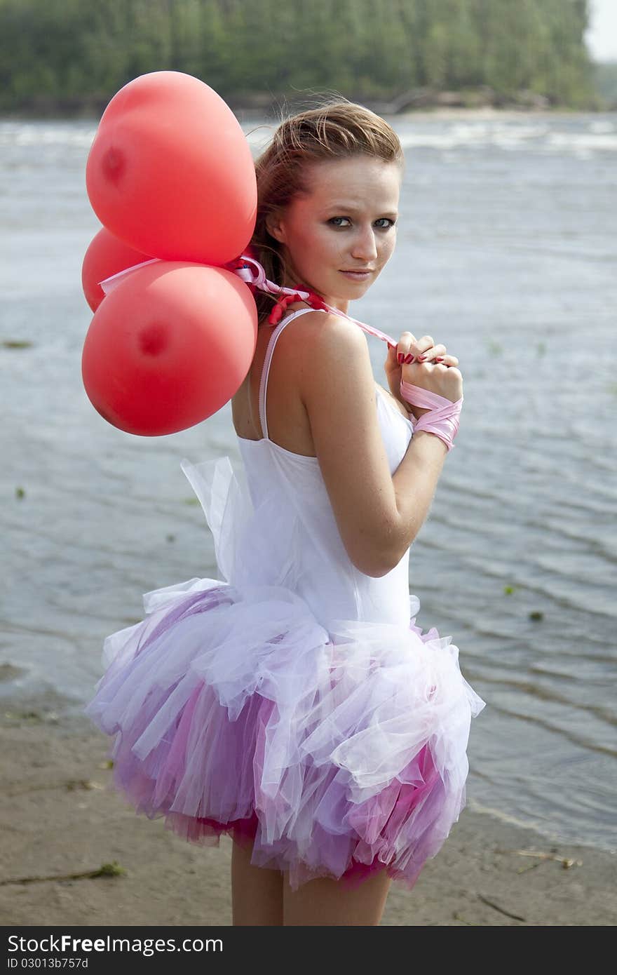 Young woman with balloons on the beach. Young woman with balloons on the beach