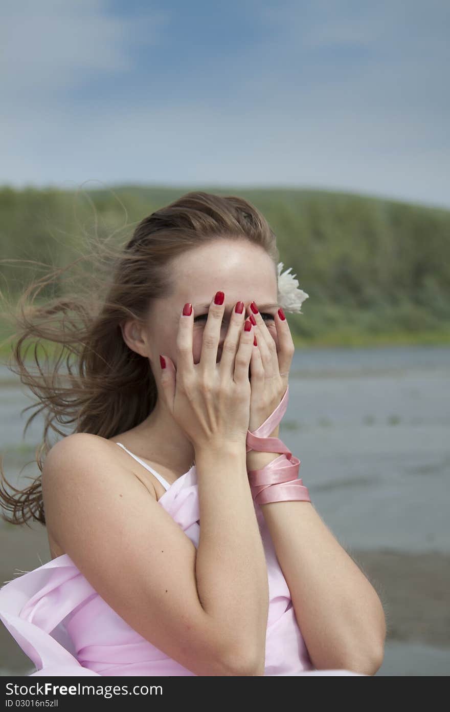 Portrait of a beautiful young woman on the beach