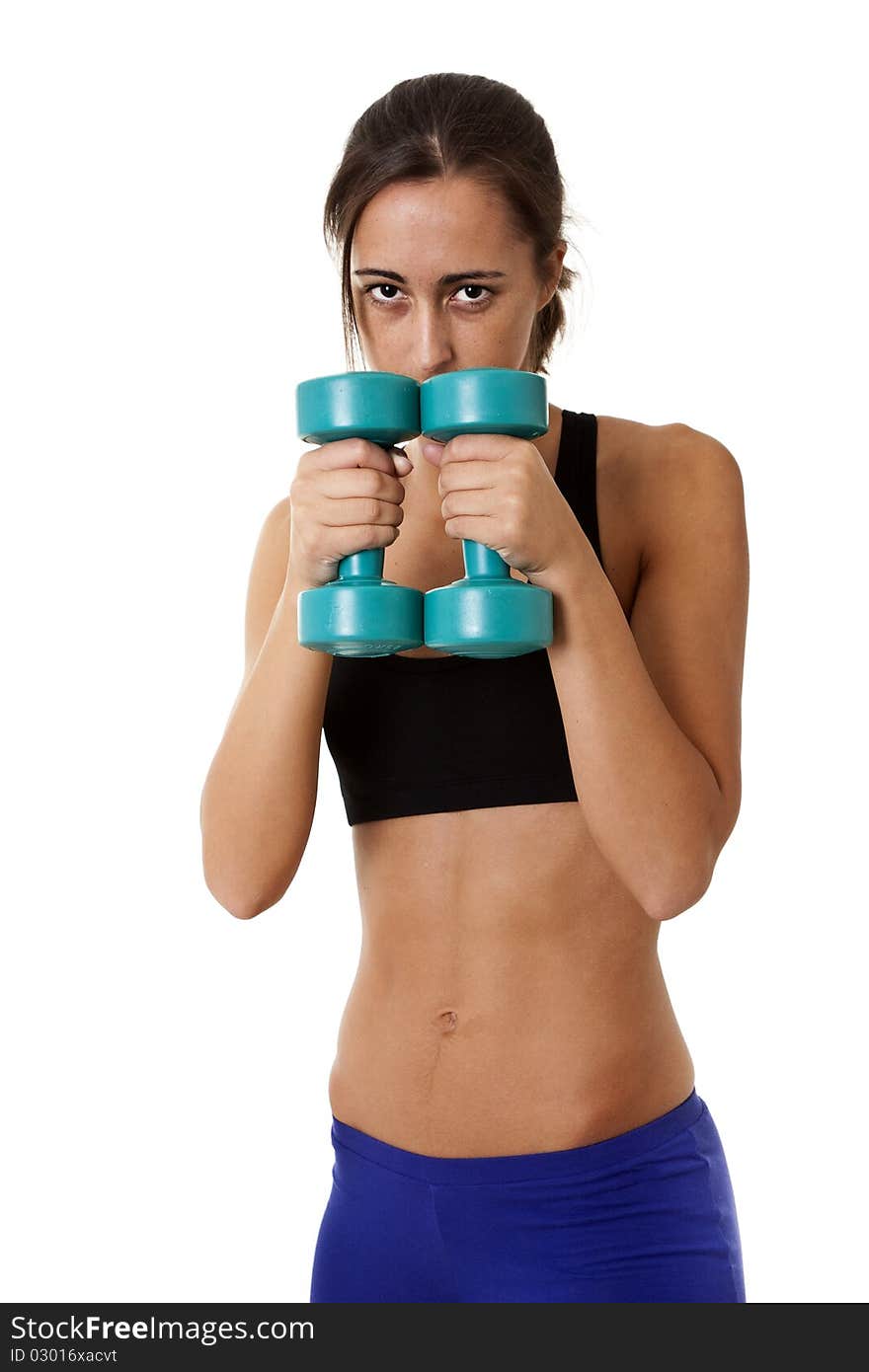 Close-up of a sports Woman working out with dumbbells. Close-up of a sports Woman working out with dumbbells