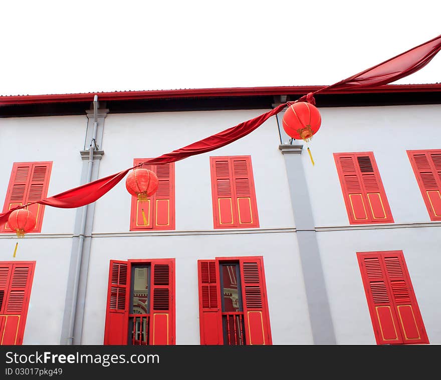 Chinese lamps with colorful building background