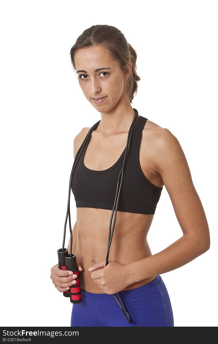 Sports Woman with jumping rope over her neck ready to work out