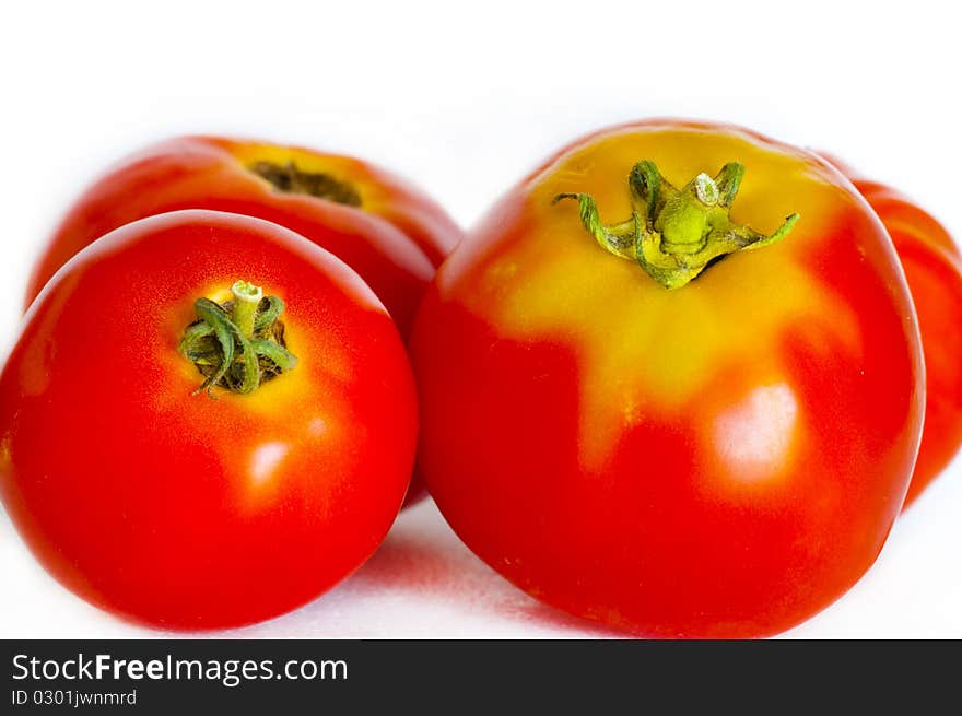 Homegrown red tomatoes on white background