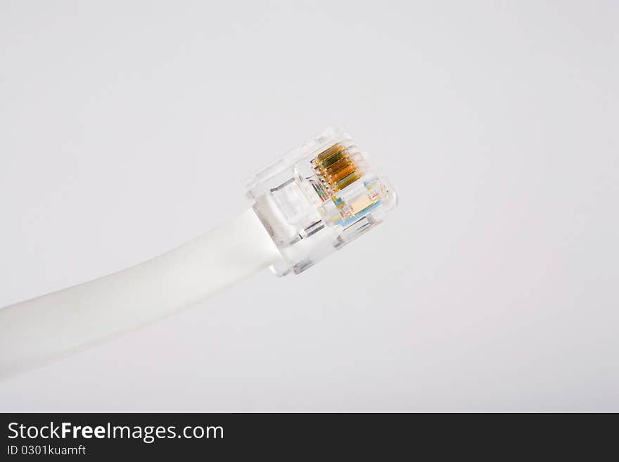 White phone cord against a white background