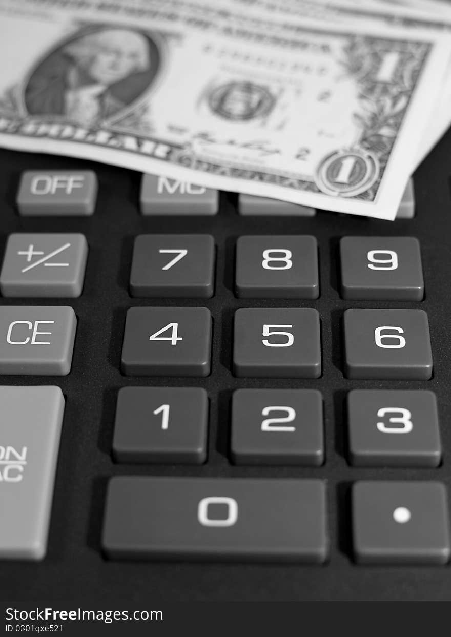 Money on keypad of a calculator close up. B&W. Money on keypad of a calculator close up. B&W