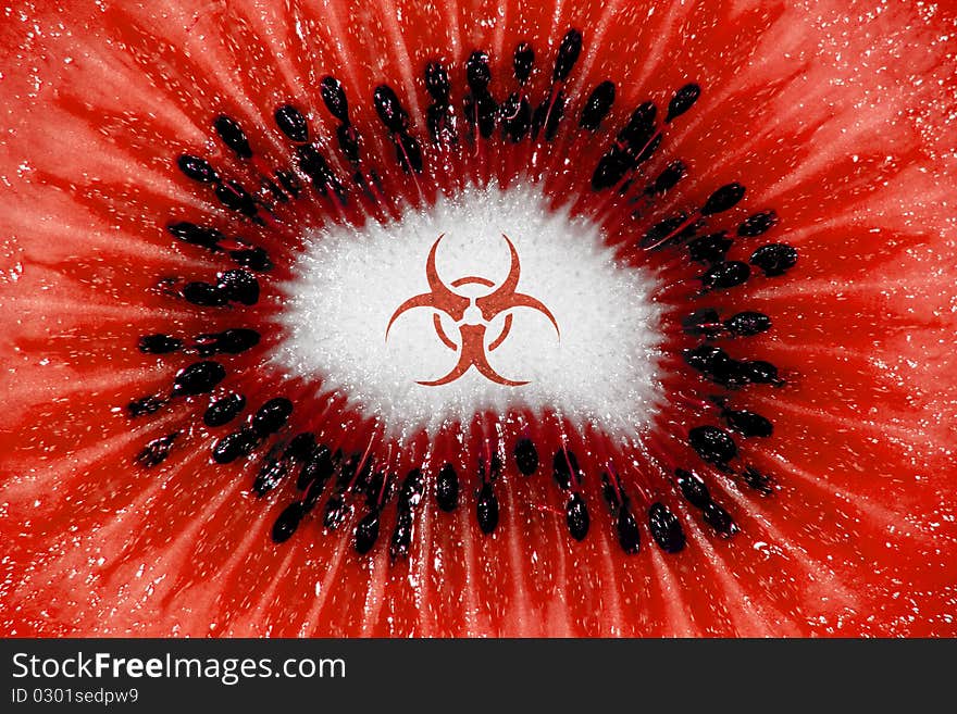 Kiwi fruit pulp well lit in a closeup with hazardous sign an color. Kiwi fruit pulp well lit in a closeup with hazardous sign an color.