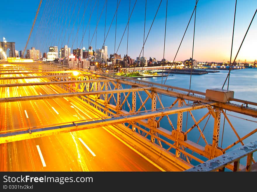 Traffic on brooklyn bridge during sunset hour. Traffic on brooklyn bridge during sunset hour