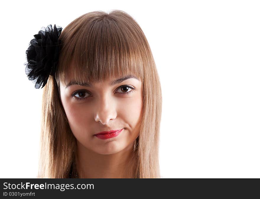 Portrait of the young girl with black rose in hair on white background