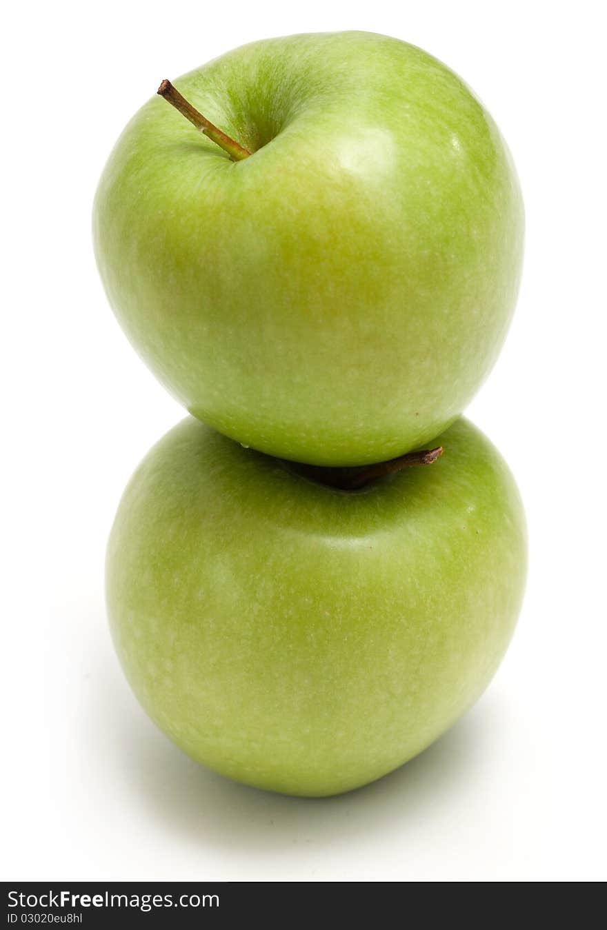 Two green apples on each other. Two green apples on each other