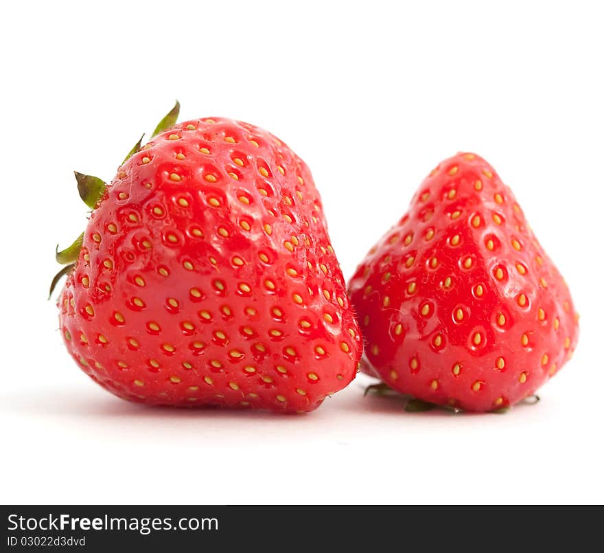 Two juicy strawberries on white background. Two juicy strawberries on white background