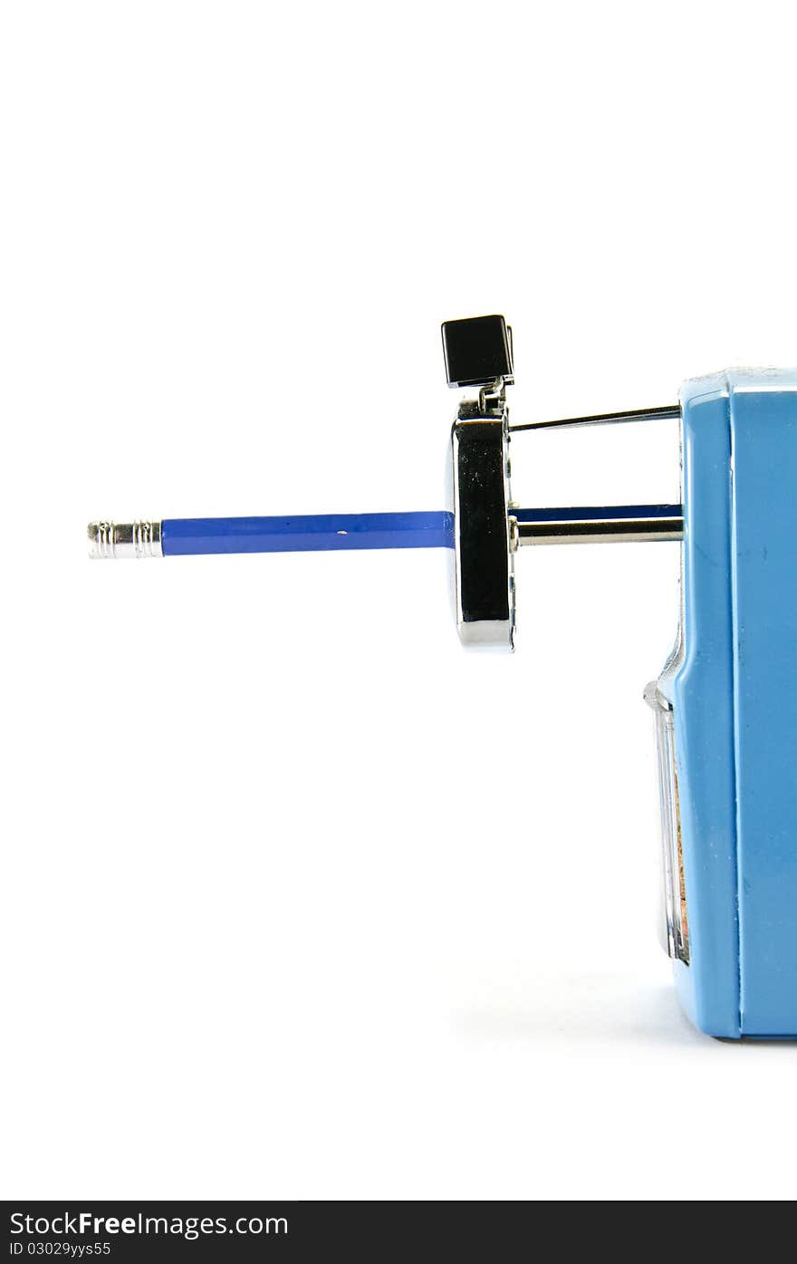 Pencil sharpener with blue pencil on white background