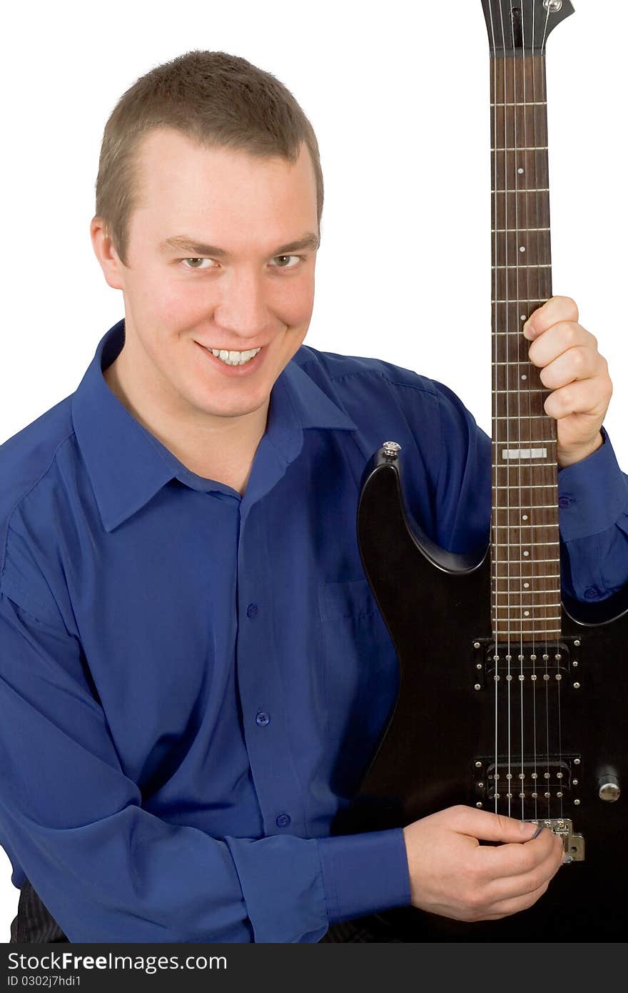 Cheerful young man with a guitar on a white background