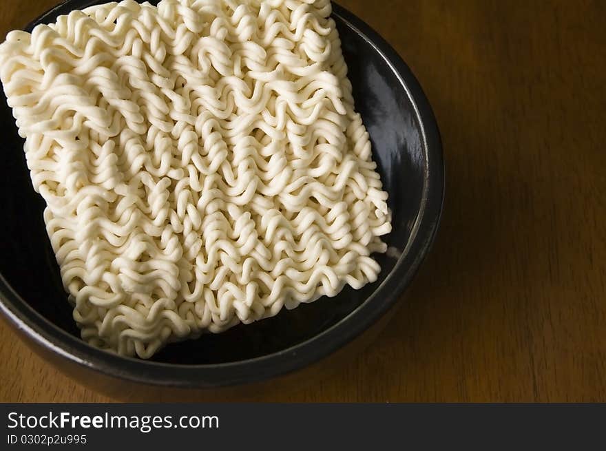 Instant noodle in black bowl