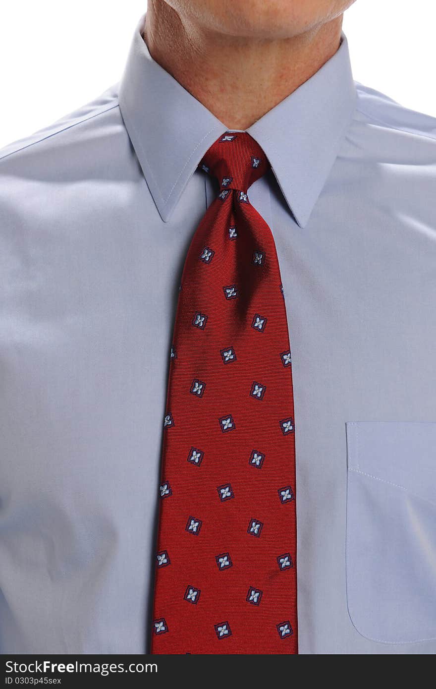 Businessman close up showing a red tie. Businessman close up showing a red tie