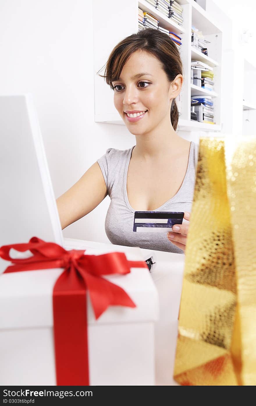 Happy shopping on-line of young woman with laptop on internet. Happy shopping on-line of young woman with laptop on internet