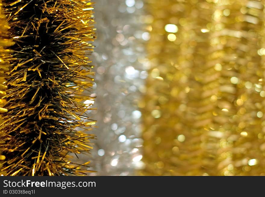 Golden christmas chain on bokeh background