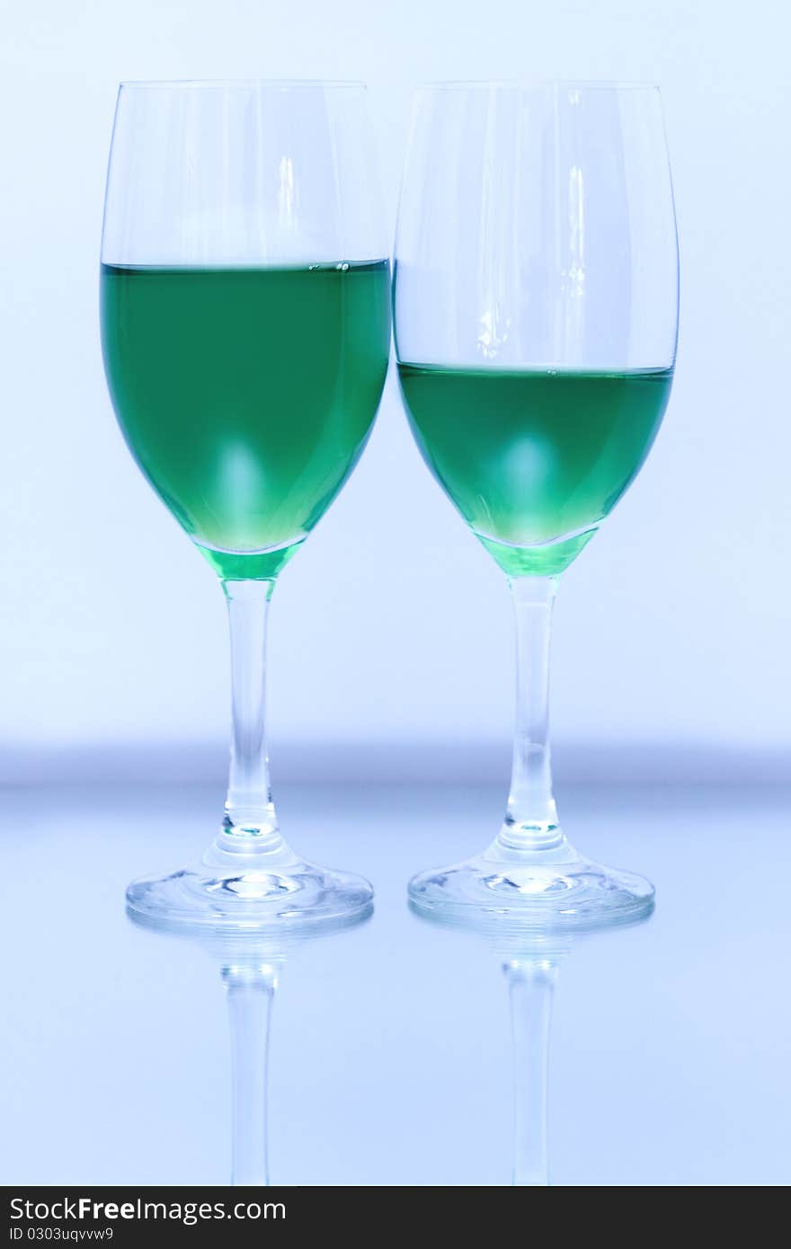 Colored glasses arranged on a glass substrate. Mirror was used as background