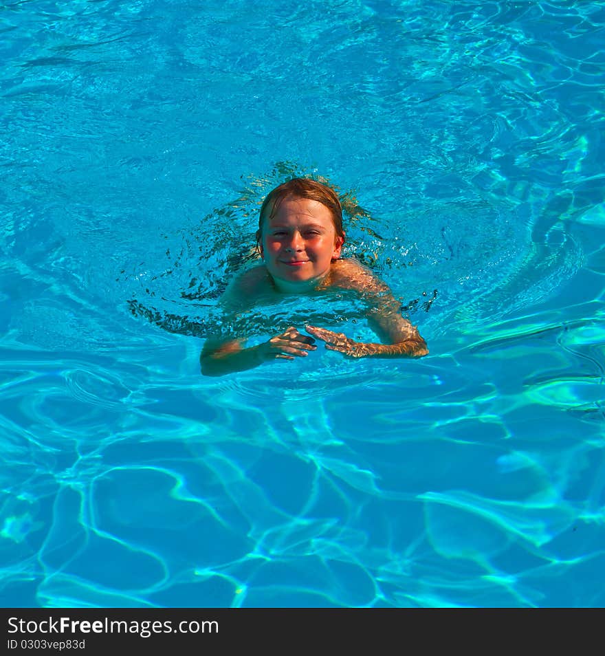 Child Has Fun In The Pool