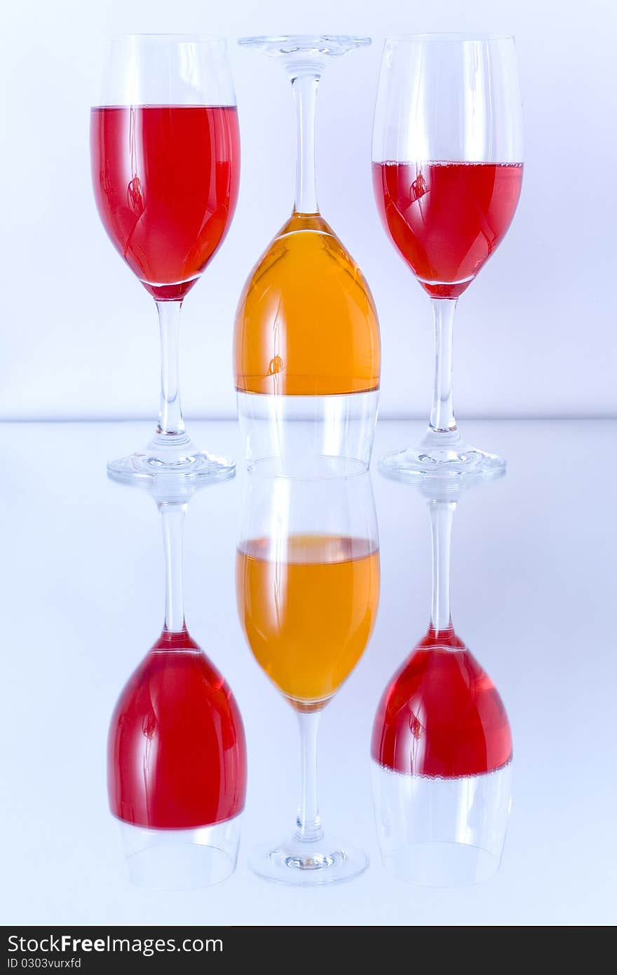 Colored glasses arranged on a glass substrate. Mirror was used as background