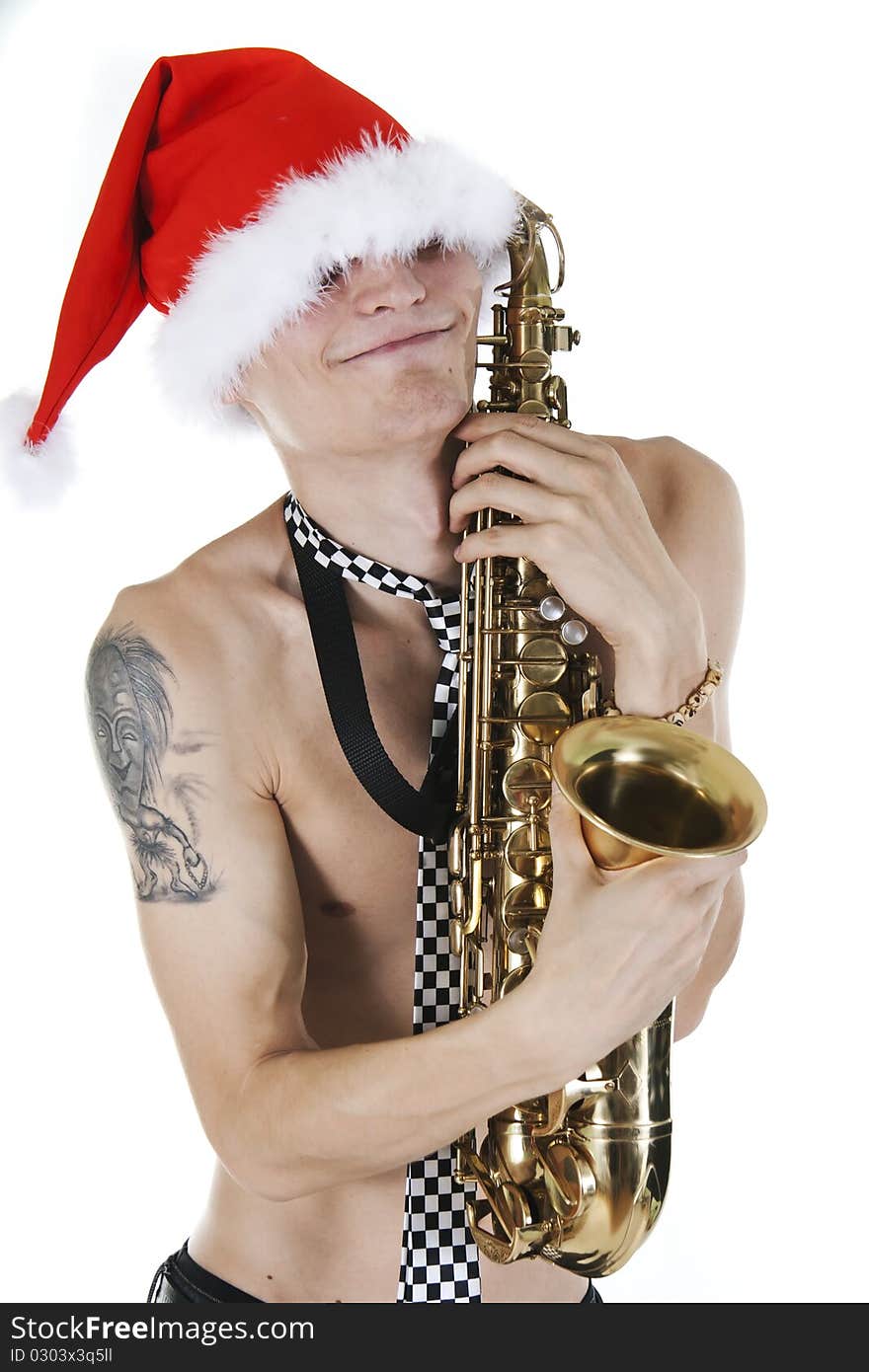 Young Santa embraces a saxophone