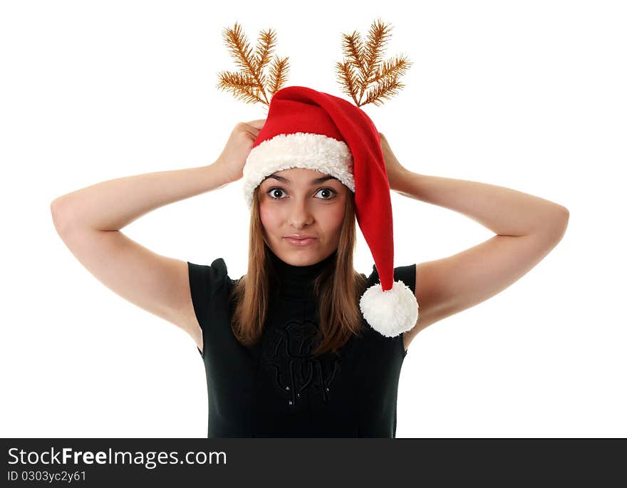 Beautiful girl in red hat santa and golden branch on white background