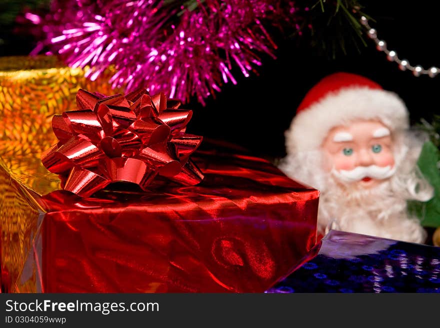 Christmas tree with gold ornament ball, close up